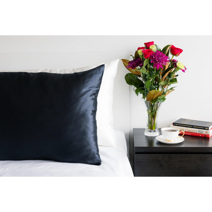 Silk pillowcase in black with a queen size cozy bedroom