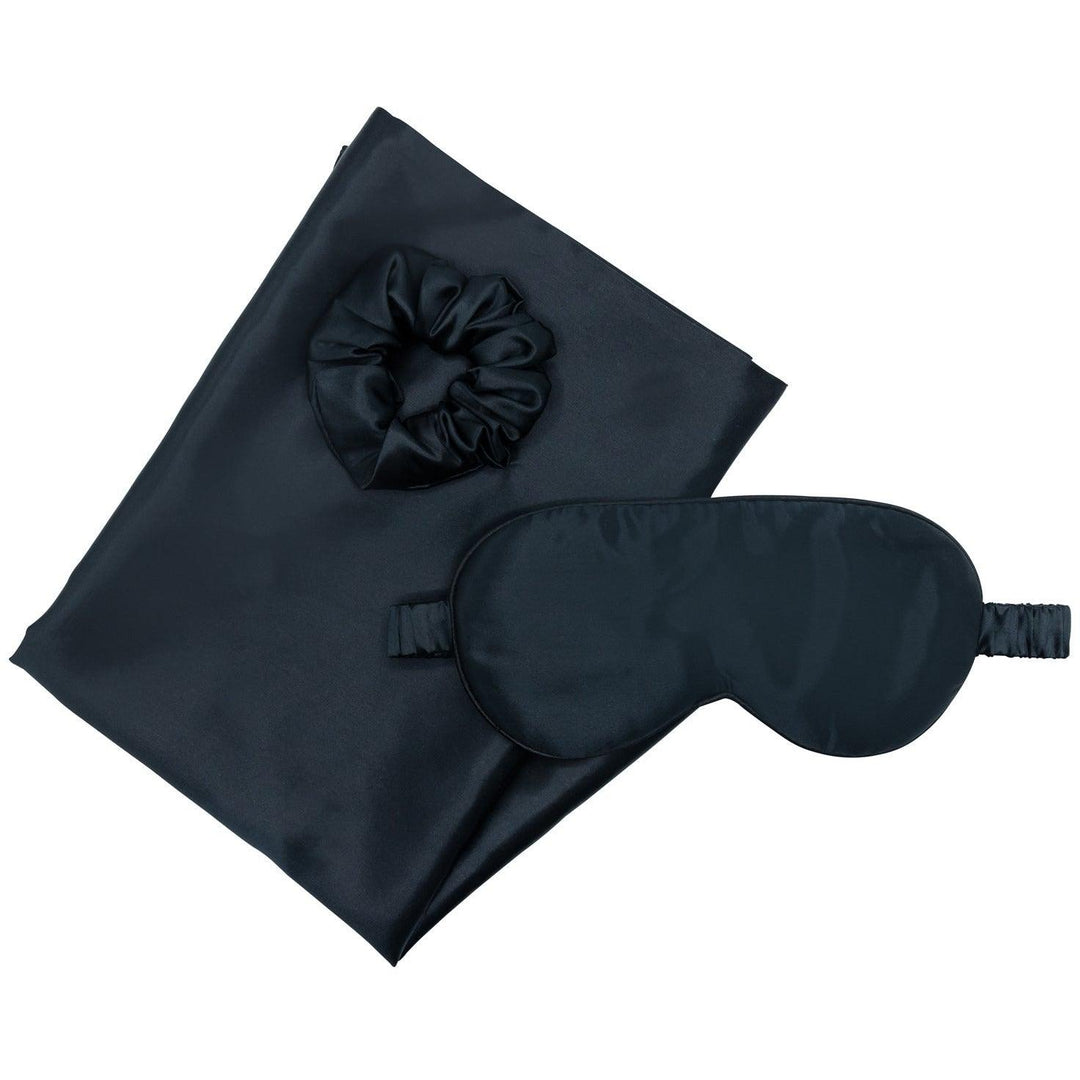 The Black Moon Flower silk gift set features a black eye mask and black scrunchie