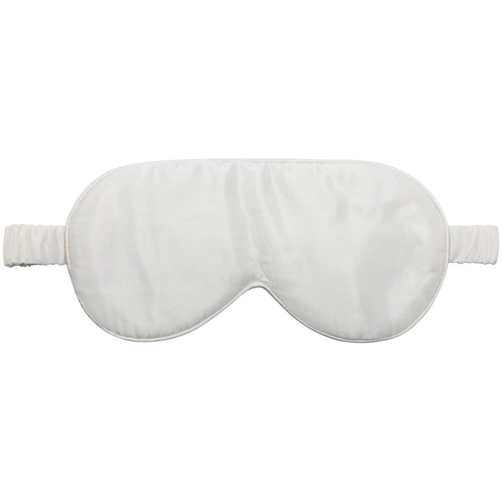 Detailed view of the White Moon Flower silk eye mask with its soft strap